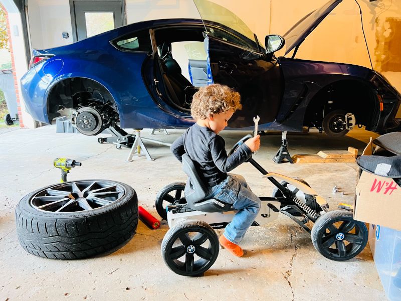 Working on His Car Like Daddy